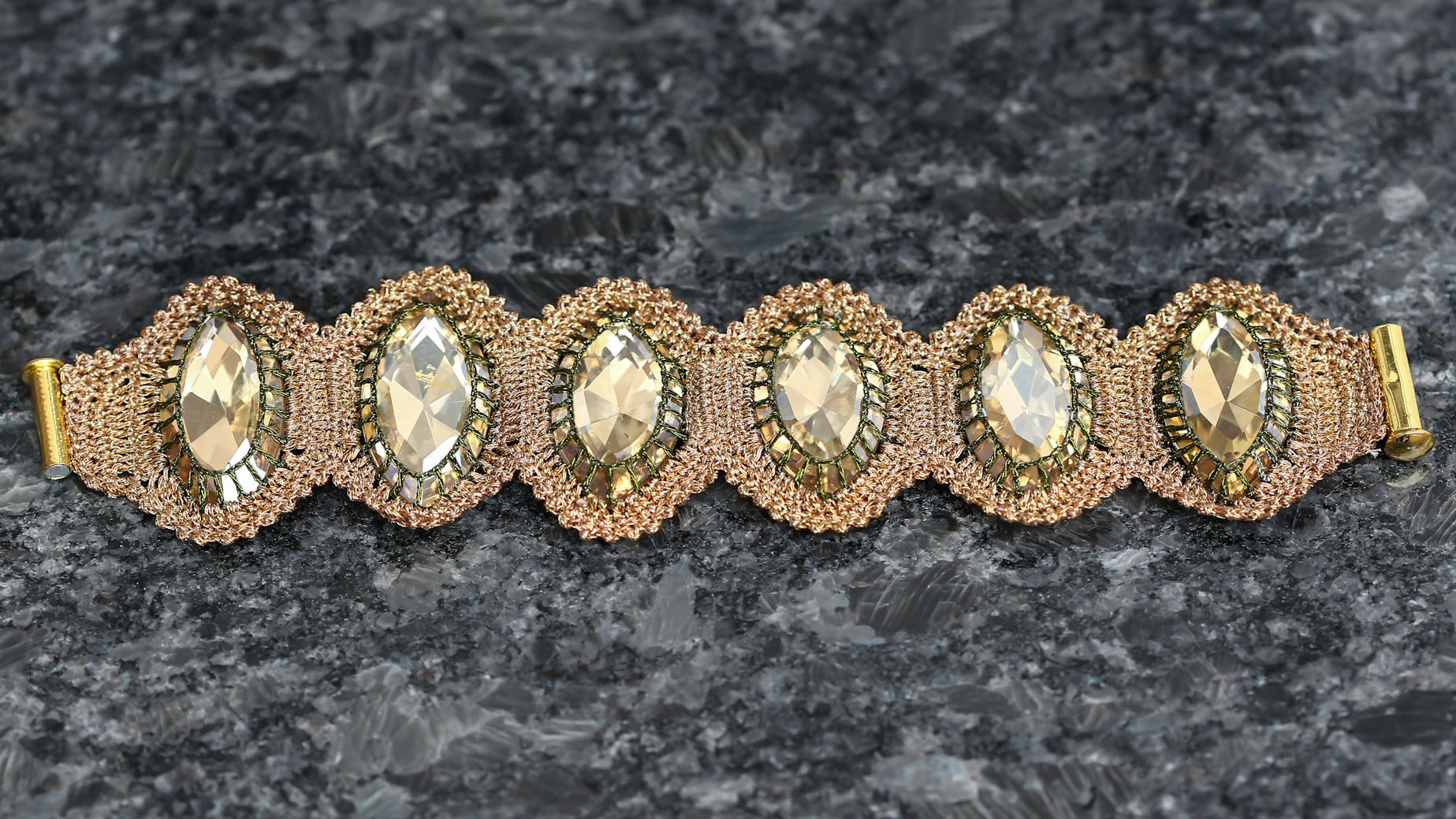 Statement bracelet with large day-shape fancy stones in champagne colour.